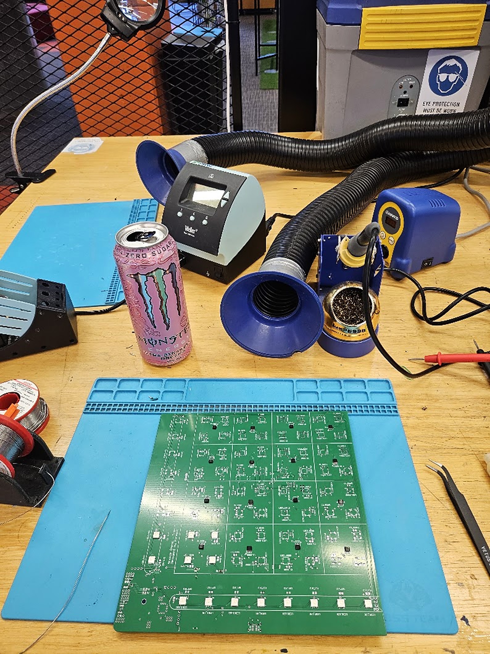 The half-populated board next to a pink Monster can