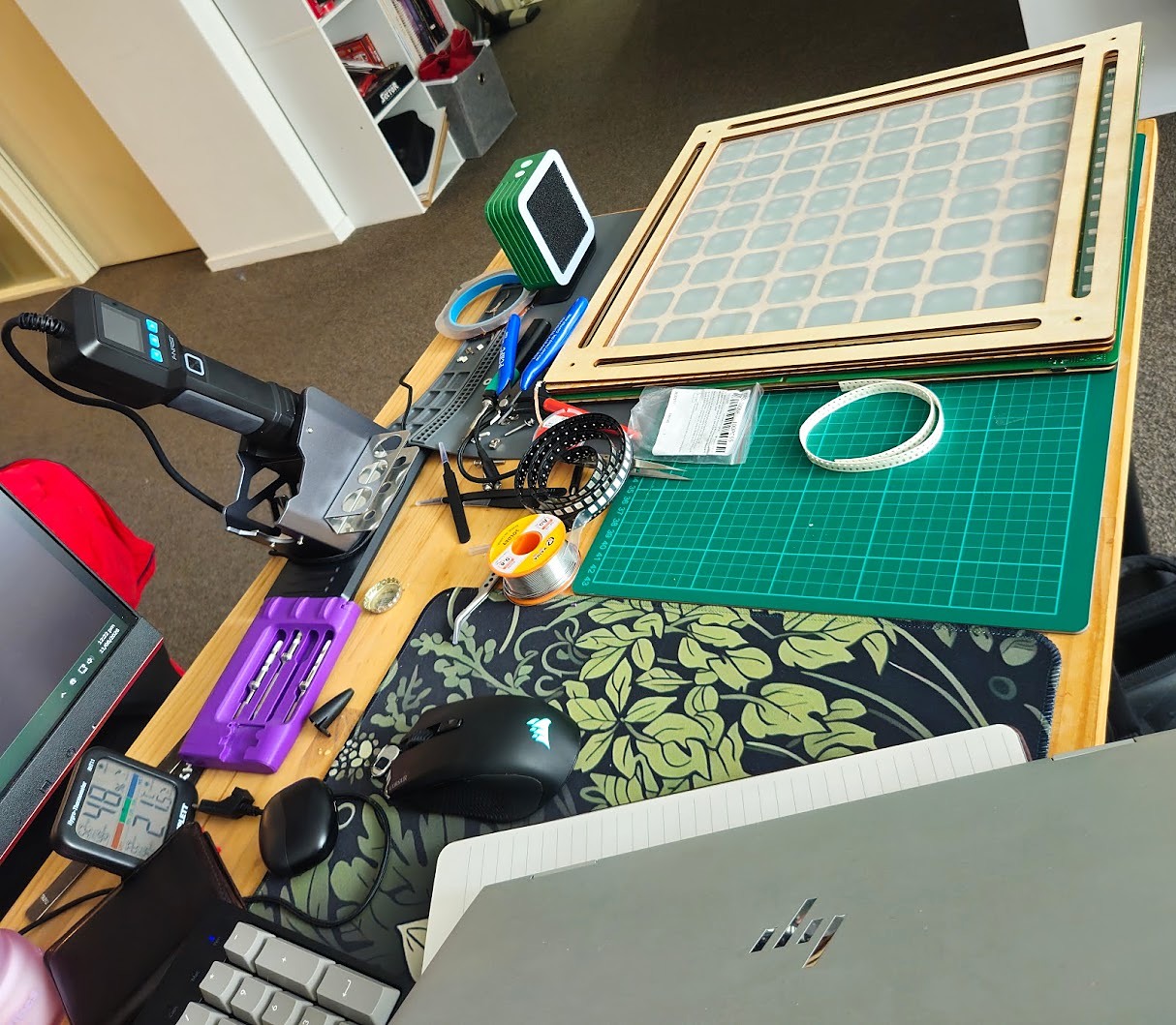 Ara's soldering station at home, with tools and reels of LEDs